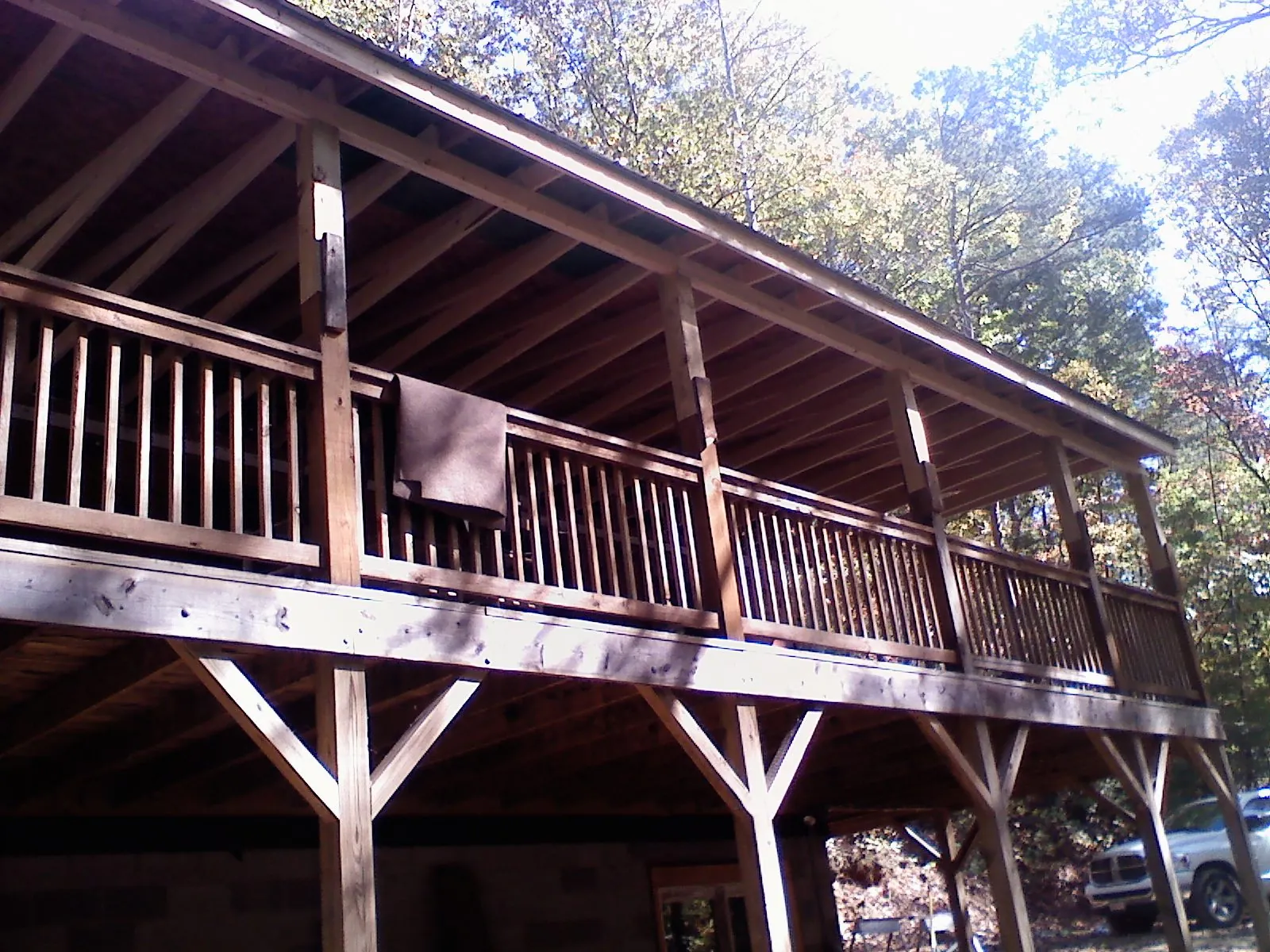 Timber framing under a new elevated porch and deck — Roof Leak Repair in Boston by Roofing Brothers